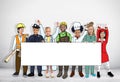 Group of Children in Dreams Job Uniform Holding Banner with Copy Royalty Free Stock Photo