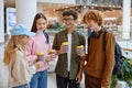 Group of children drinking coffee sharing emotion during shopping time Royalty Free Stock Photo