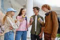 Group of children drinking coffee sharing emotion during shopping time Royalty Free Stock Photo