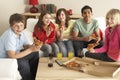 Group Of Children Eating Pizza At Home Royalty Free Stock Photo