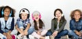 Group of children enjoy the music by headphones