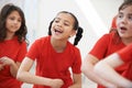 Group Of Children Enjoying Dance Class Together