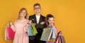 group of children go shopping. black friday concept. kids on cyber monday. big sale. teen girls and boy hold paper bag Royalty Free Stock Photo