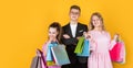 Group of children go shopping. black friday concept. kids on cyber monday. big sale. teen girls and boy hold paper bag Royalty Free Stock Photo