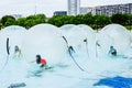 Group of children having fun inside balloons Water Walking Ball, a summer attraction for tourists Royalty Free Stock Photo