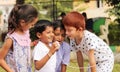 Group of children having fun by playing with String Telephone during holiday summer camp - Concept of brain development and Royalty Free Stock Photo