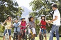 Group Of Children Having Safety Lesson From Adult Whilst Riding Bikes In Countryside Royalty Free Stock Photo