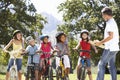 Group Of Children Having Safety Lesson From Adult Whilst Riding Royalty Free Stock Photo
