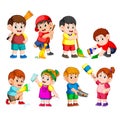 A group of children holding the cleaning tools to clean something Royalty Free Stock Photo