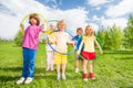 Group of children holding hula hoops in park Royalty Free Stock Photo