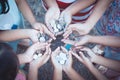 Group of children holding money in hands in the circle together Royalty Free Stock Photo