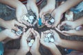 Group of children holding money in hands in the circle together Royalty Free Stock Photo