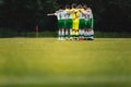 Group of children huddling with coach. Youth soccer football team group photo