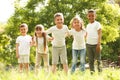 Group of children huddling in park