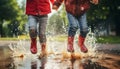 group of children joyfully jumping and splashing in red rain boots on a rainy summer day