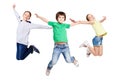 Group of children jumping at white isolated studio background Royalty Free Stock Photo