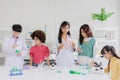 Group of children kids teen playing in science chemical lab for learning education in school Royalty Free Stock Photo