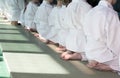 Group of children in kimono sitting on tatami on martial arts training seminar Royalty Free Stock Photo