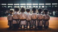 A group of children in kimonos sitting on a mat