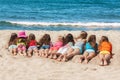 Group of children lying on the beach Royalty Free Stock Photo