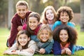 Group Of Children Lying On Grass Together In Park Royalty Free Stock Photo