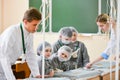 A group children medical training. A group of children are studying surgery. Teaching medicine. Young doctors at a seminar in a