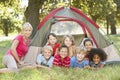 Group Of Children With Mother Having Fun In Tent In Countryside Royalty Free Stock Photo