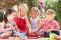 Group Of Children At Outdoor Tea Party Royalty Free Stock Photo