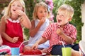 Group Of Children At Outdoor Tea Party Royalty Free Stock Photo