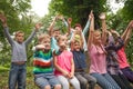 Group of children on a park bench Royalty Free Stock Photo