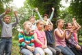 Group of children on a park bench Royalty Free Stock Photo