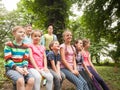 Group of children on a park bench Royalty Free Stock Photo