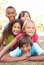 Group Of Children Piled Up In Park