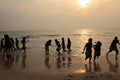 Group of children play on the beach