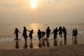 Group of children play on the beach