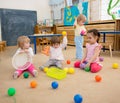 Group of children playing balls in kindergarten or daycare centre Royalty Free Stock Photo