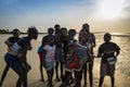 Group of children playing by the beach in the island of Orango at sunset, in Guinea Bissau