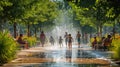 A group of children are playing in a fountain in a park AIG41 Royalty Free Stock Photo