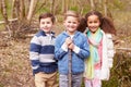 Group Of Children Playing Game In Forest Royalty Free Stock Photo