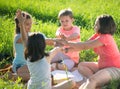 Group of children playing on grass Royalty Free Stock Photo