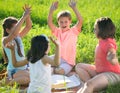 Group of children playing on grass Royalty Free Stock Photo