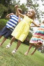 Group Of Children Playing Outdoors Together Royalty Free Stock Photo