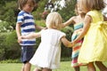 Group Of Children Playing Outdoors Together Royalty Free Stock Photo