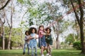 Group of children playing tug of war at the park. Royalty Free Stock Photo