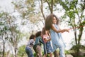 Group of children playing tug of war at the park. Royalty Free Stock Photo