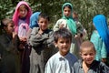 A group of children pose for photos at a nomad settlement in central Afghanistan