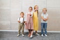 Group of children posing with different objects related to learning and development. Royalty Free Stock Photo