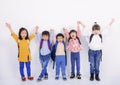 Group of children posing with raised hands Royalty Free Stock Photo