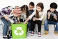 Group of children with a recycling symbol