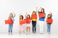 Group of children with red banners isolated in white Royalty Free Stock Photo